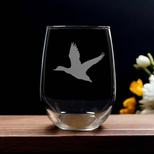 Stemless  wine Glass etched with silhouette of a flying duck - Copyright Hues in Glass
