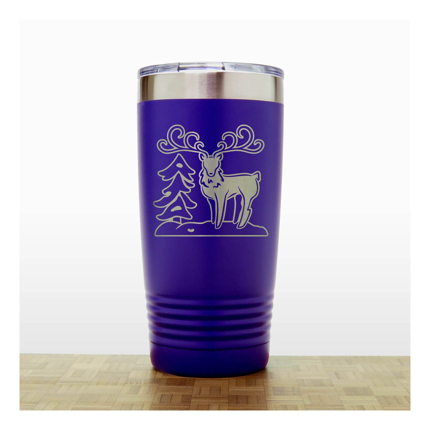 Purple - Insulated Travel Mug with the design of a Reindeer sta nding beside a Christmas tree - Copyright Hues in Glass