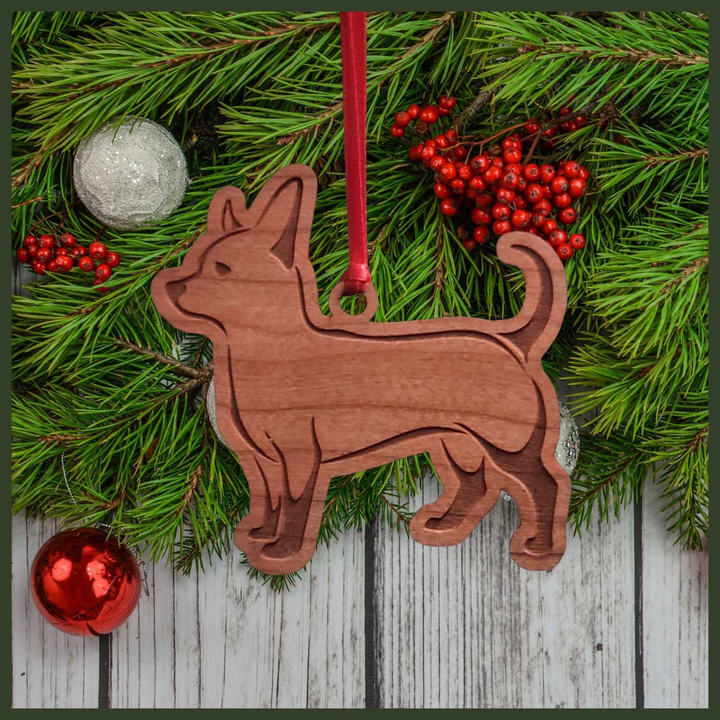A Chihuahua cherry wood veneer ornament, with the dog in profile.