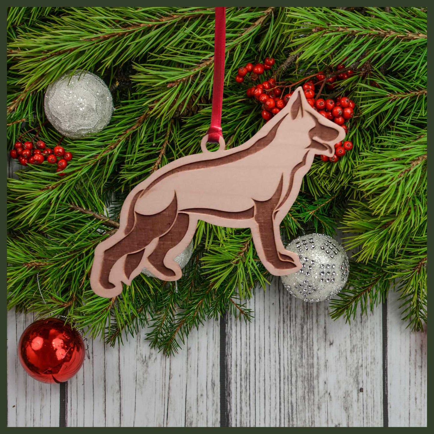 A German Shepherd maple wood veneer ornament, with the dog in profile.