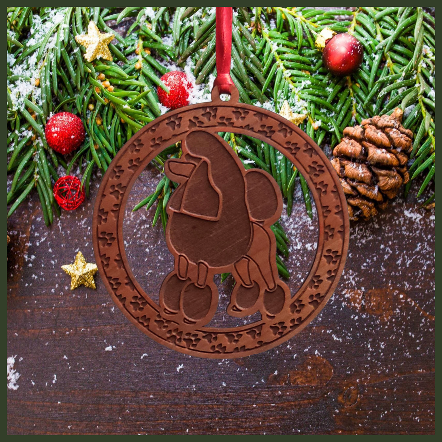 A round cherry wood veneer ornament with a border of small paw prints. The center of the ornament is a Poodle dog.