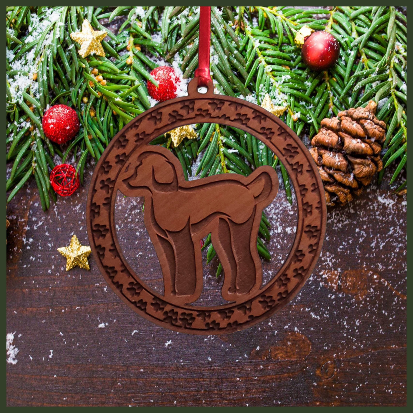 A round cherry wood veneer ornament with a border of small paw prints. The center of the ornament is a Poodle dog.