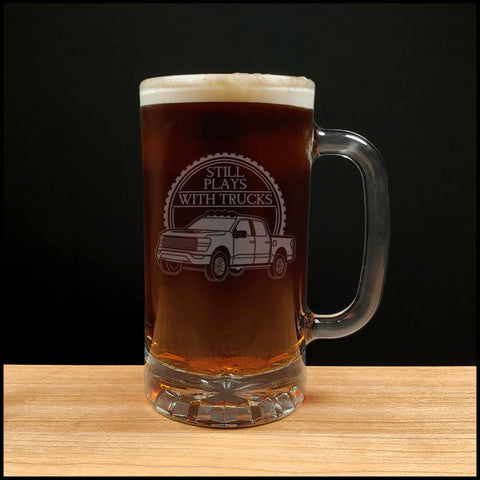 Classic Truck Design Beer Mug with the "Still Plays with Trucks" in uppercase Dark Beer - Copyright Hues in Glass