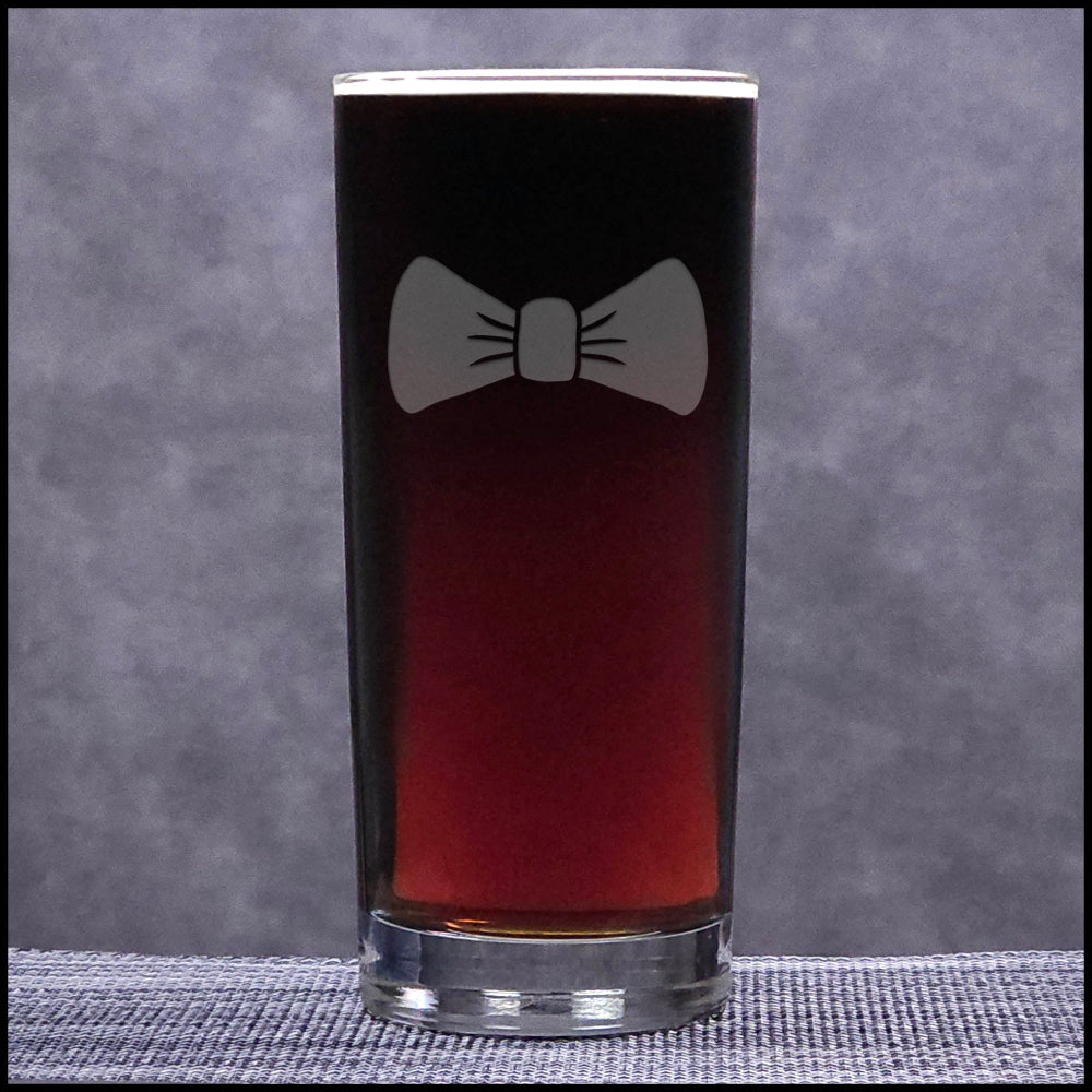 Glass with a bow tie design on a gray background