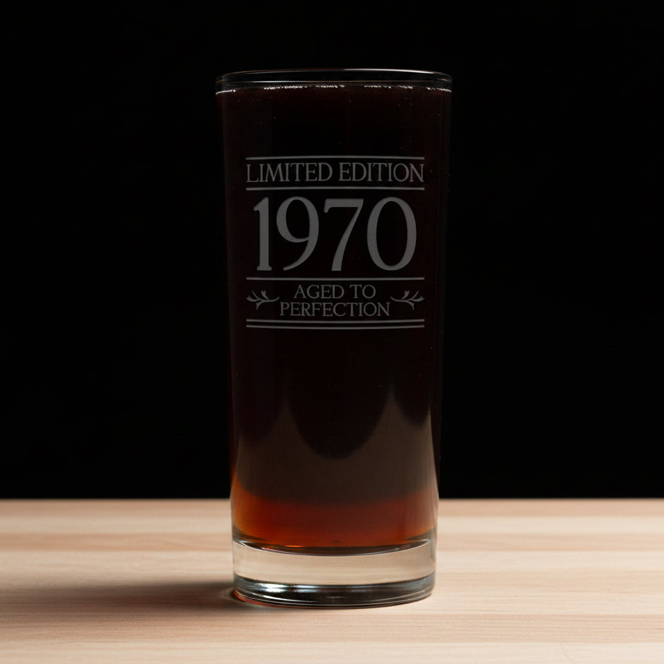 Glass with 'Limited Edition 1970 Aged to Perfection' text on a gray background