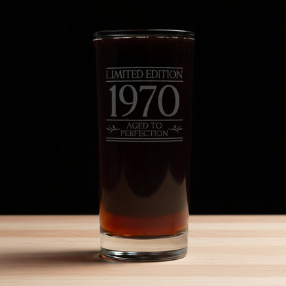 Glass with 'Limited Edition 1970 Aged to Perfection' text on a gray background