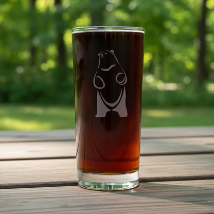 A 15oz Cooler Glass with an etched Bear Standing on hind legs with trees in the background