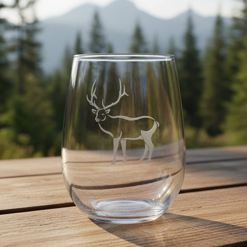 17oz Stemless Wine Glass with an etched image of an elk etched image with a background of a misty forest