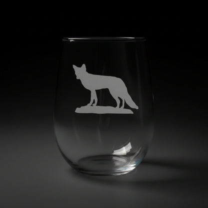 17oz Stemless Wine Glass with an etched image of a fox 
and a green couch in the background