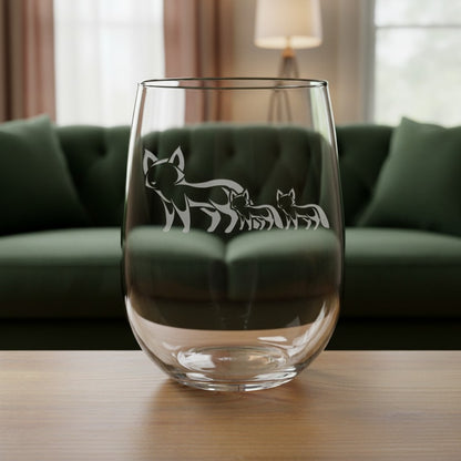 17oz Stemless Wine Glass with an etched image of a fox 
and a green couch in the background
