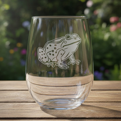 17oz Stemless Wine Glass with an etched image of a frog with a background of garden greenery 