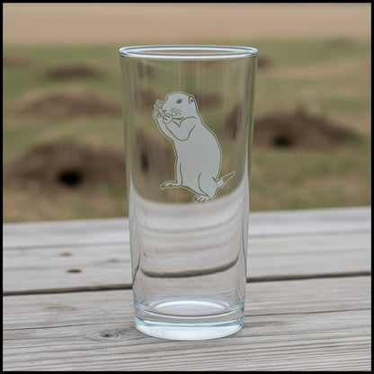15oz Cooler  Glass with an etched image of a sitting frog  with a dug up field  in the  background