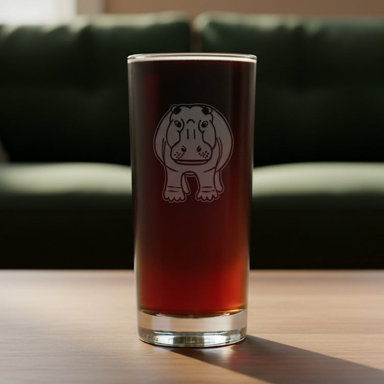 15oz Cooler Glass with an etched image of a hippo and a green couch in the background
