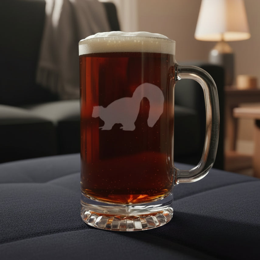 Glass mug with beer and a etched skunk silhouette on a wooden surface with black background