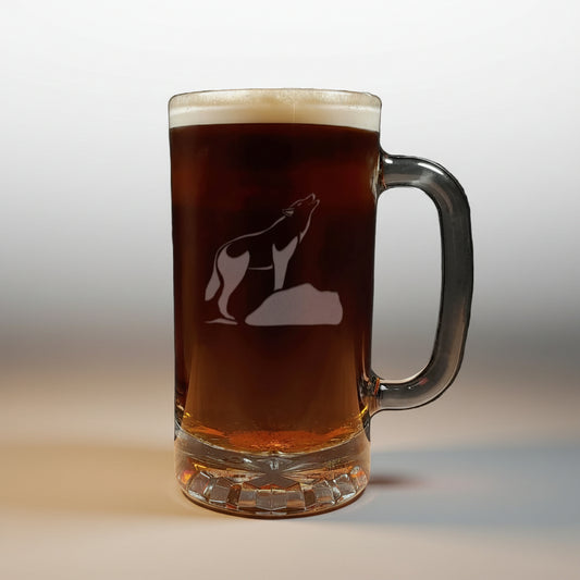 Beer mug with a wolf etching on a wooden surface and black background