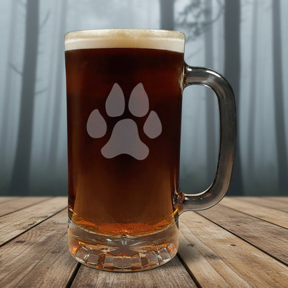 16oz Beer Mug with an etched image of a dog paw print with a background of a misty forest