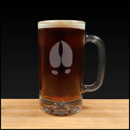 16oz Beer Mug with an etched image of a bear track a black background