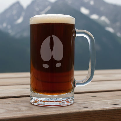 16oz Beer Mug with an etched image of a moose track with a background of  misty mountains