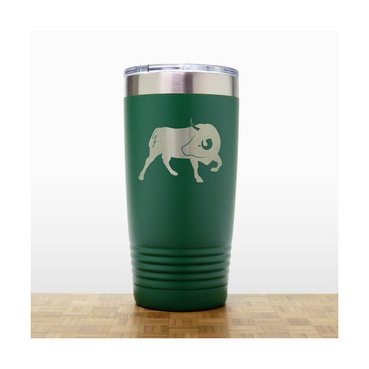 Green tumbler with a silver bull design 