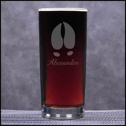 A 15.75oz Cooler Glass with an etched Moose Track and Personalization - Copyright Hues in Glass
