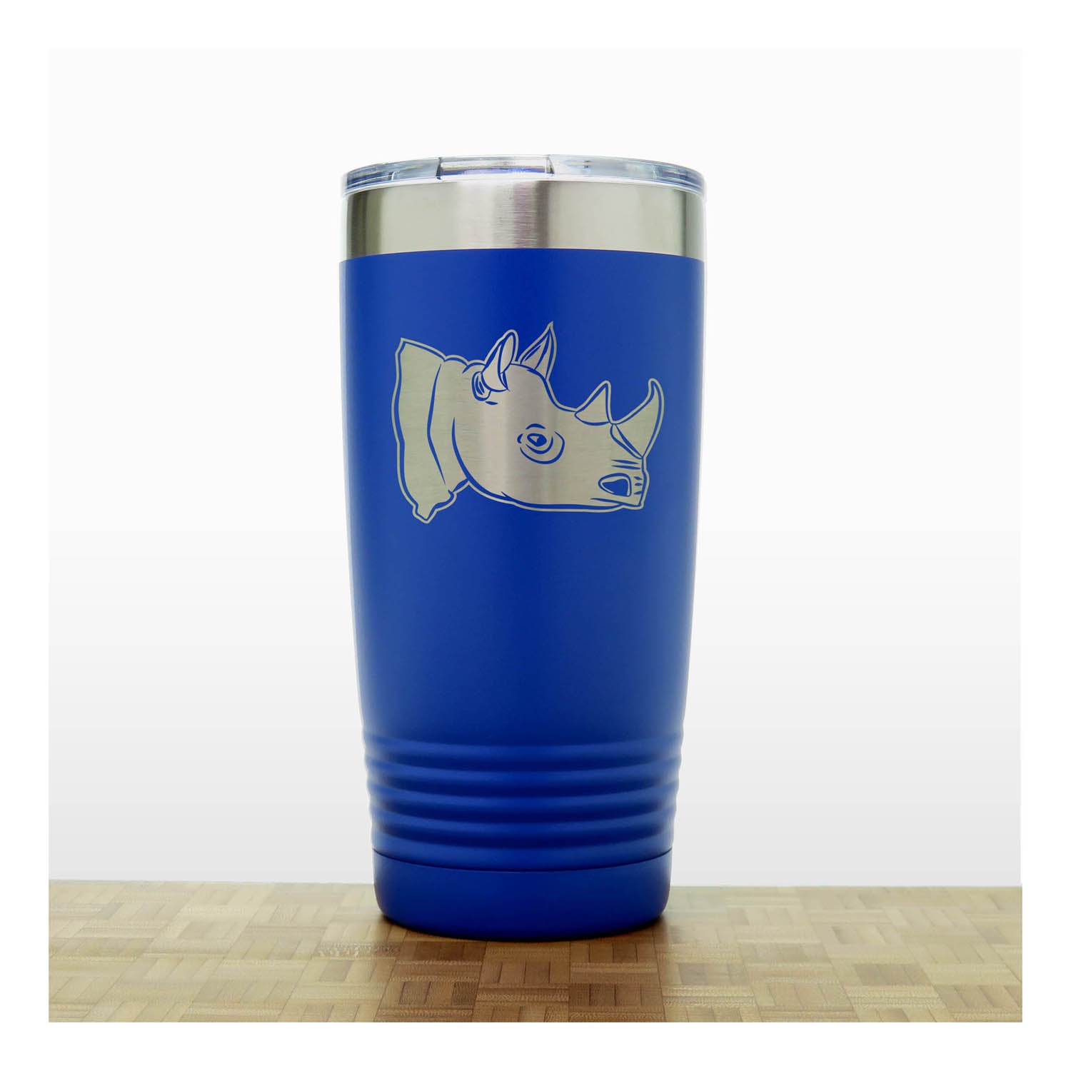 Blue insulated tumbler with rhino design on a white background