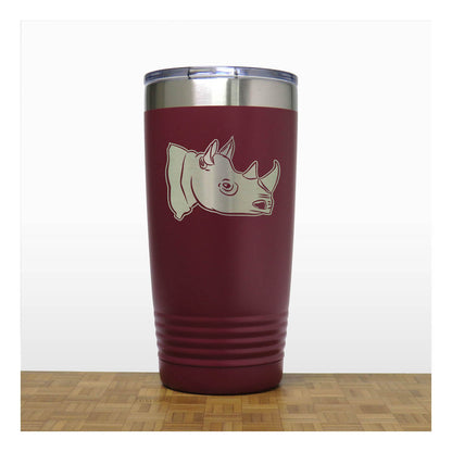 Maroon tumbler with rhino design on a white background