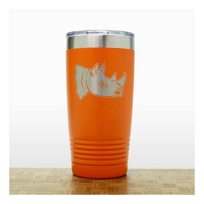 Orange tumbler with a rhino design on a white background