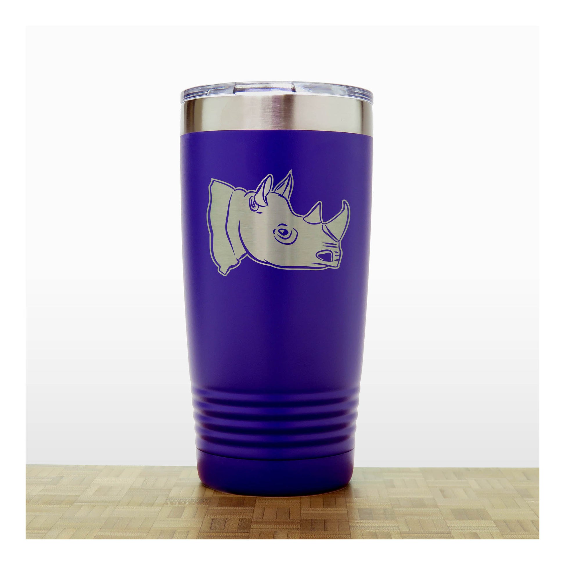 Purple tumbler with a rhino design on a white background