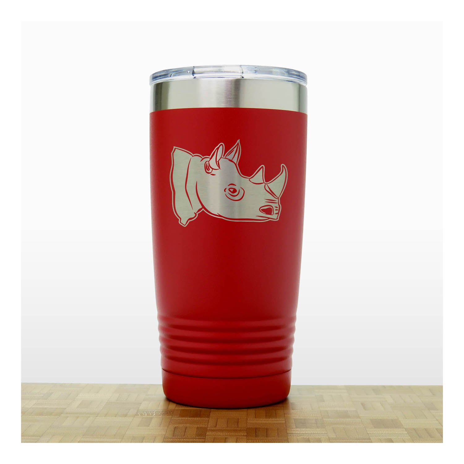 Red tumbler with a rhino design on a white background