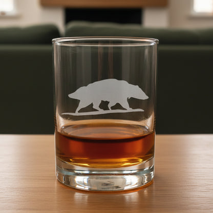 13oz Whiskey Glass with an etched image of a badger and a green couch in the background