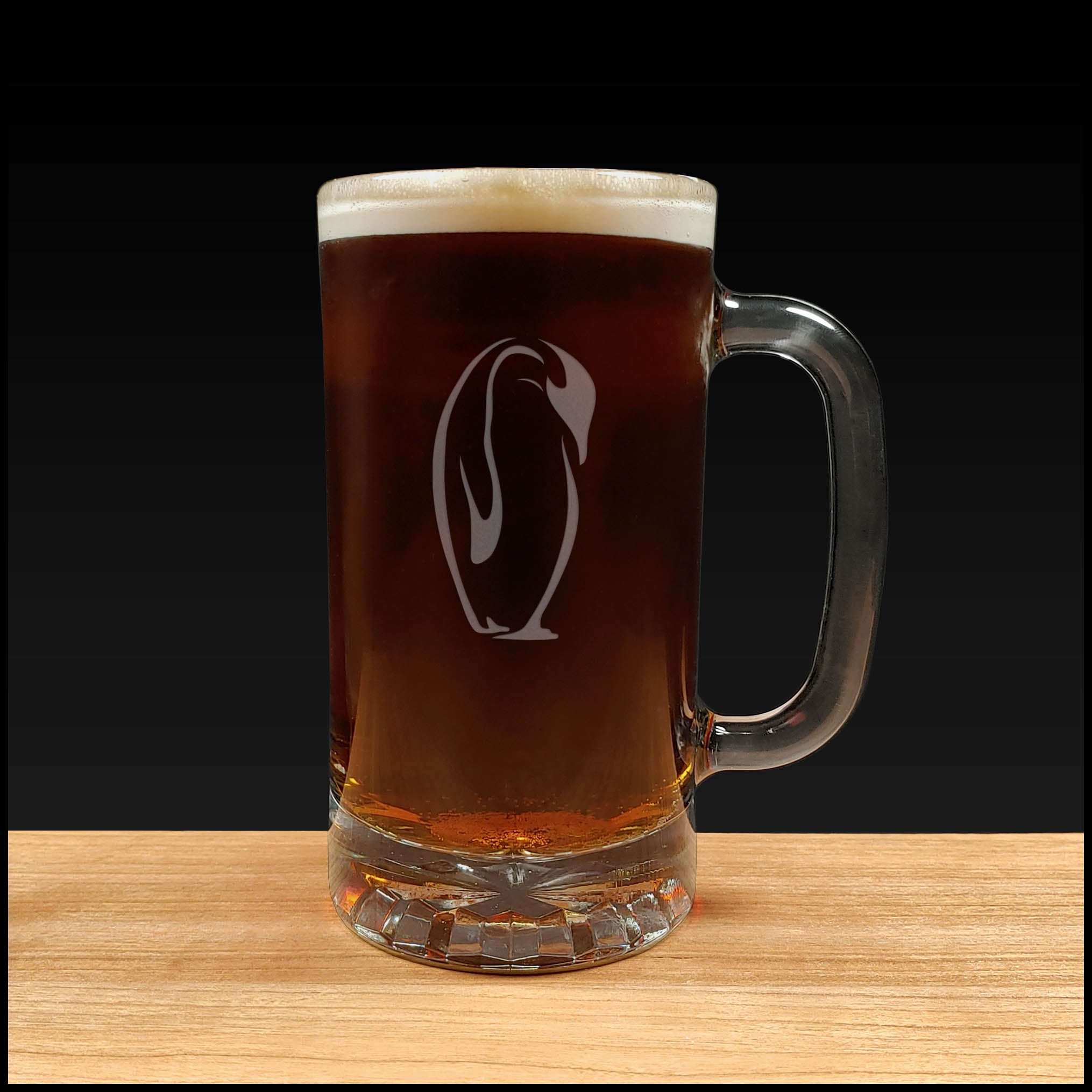 penguin design on a 16oz handled Beer Mug containing a Dark Beer - Copyright Hues in Glass
