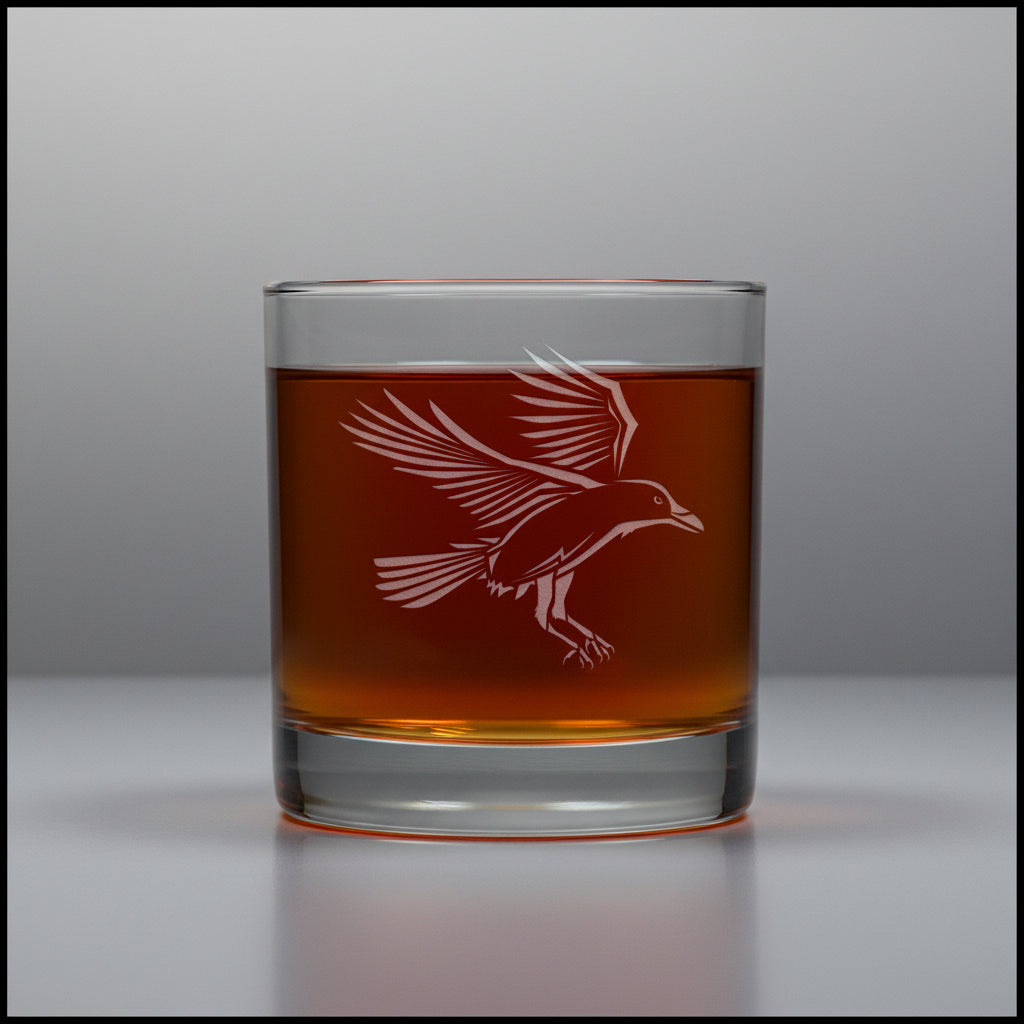 11oz whiskey glass with an etched image of a raven with a grey background