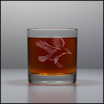 11oz whiskey glass with an etched image of a raven with a grey background