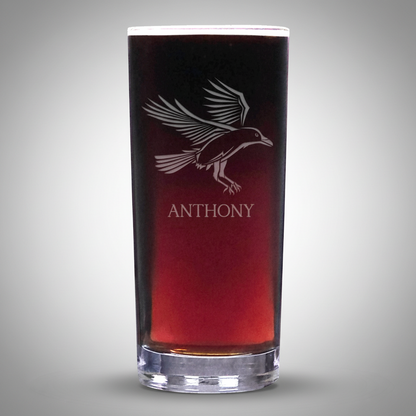 Glass with a bird design and 'Anthony' text on a white background