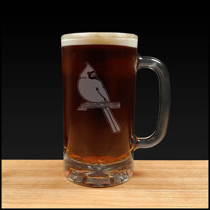 Glass mug with a Cardinal bird design filled with beer on a wooden surface