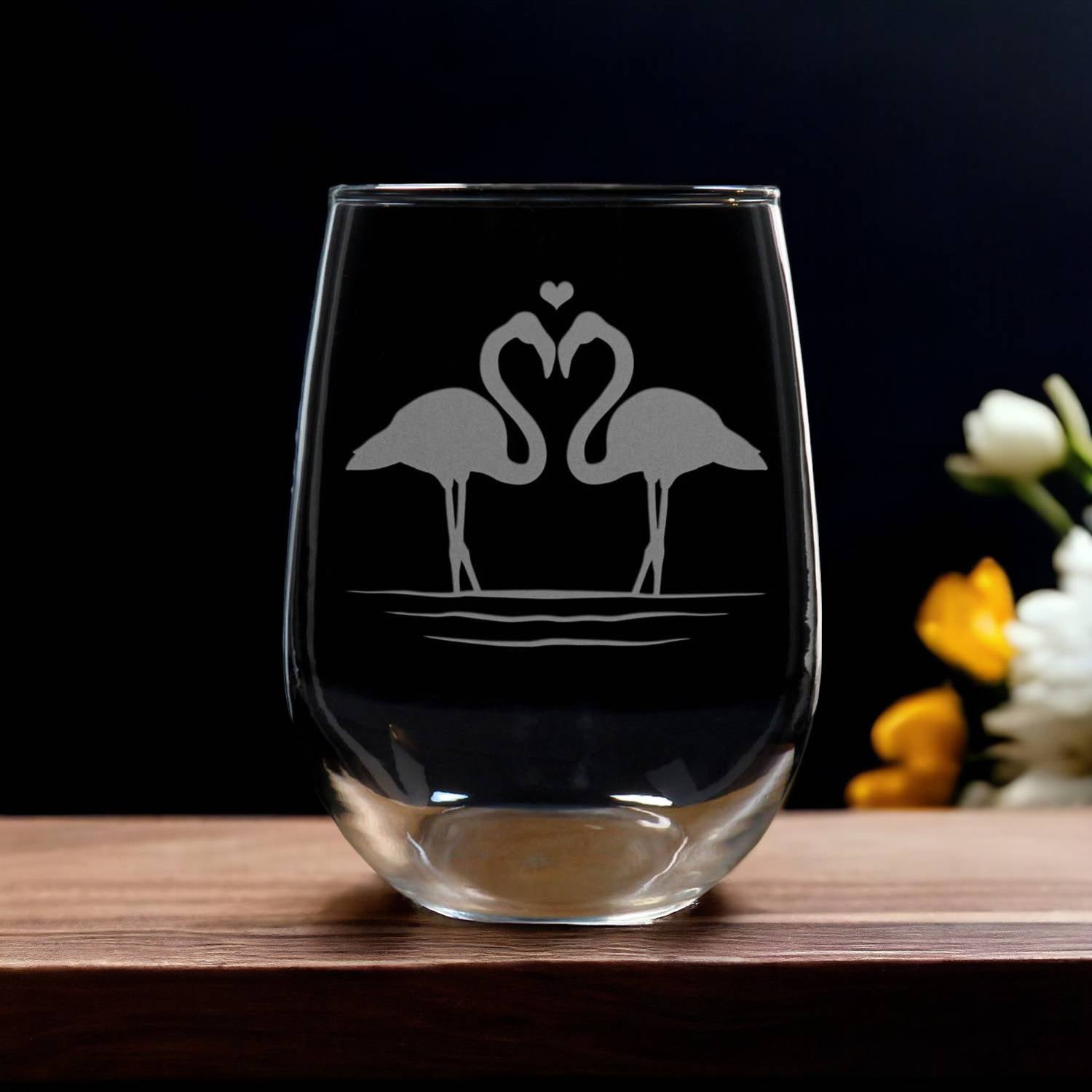 Stemless  wine Glass etched with two flamingoes face to face and a heart above their heads - Copyright Hues in Glass