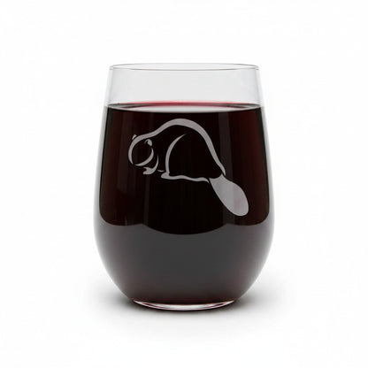 A stemless wine glass filled with red wine, featuring an etched beaver silhouette on the front, set against a plain white background.