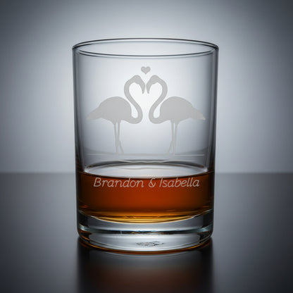 Glass tumbler with engraved flamingo design and 'Brandon & Isabella' text 