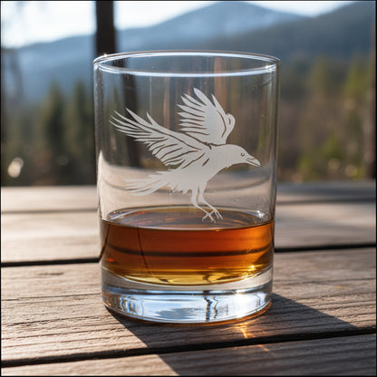 13oz whiskey glass with an etched image of a Raven an a wood surface