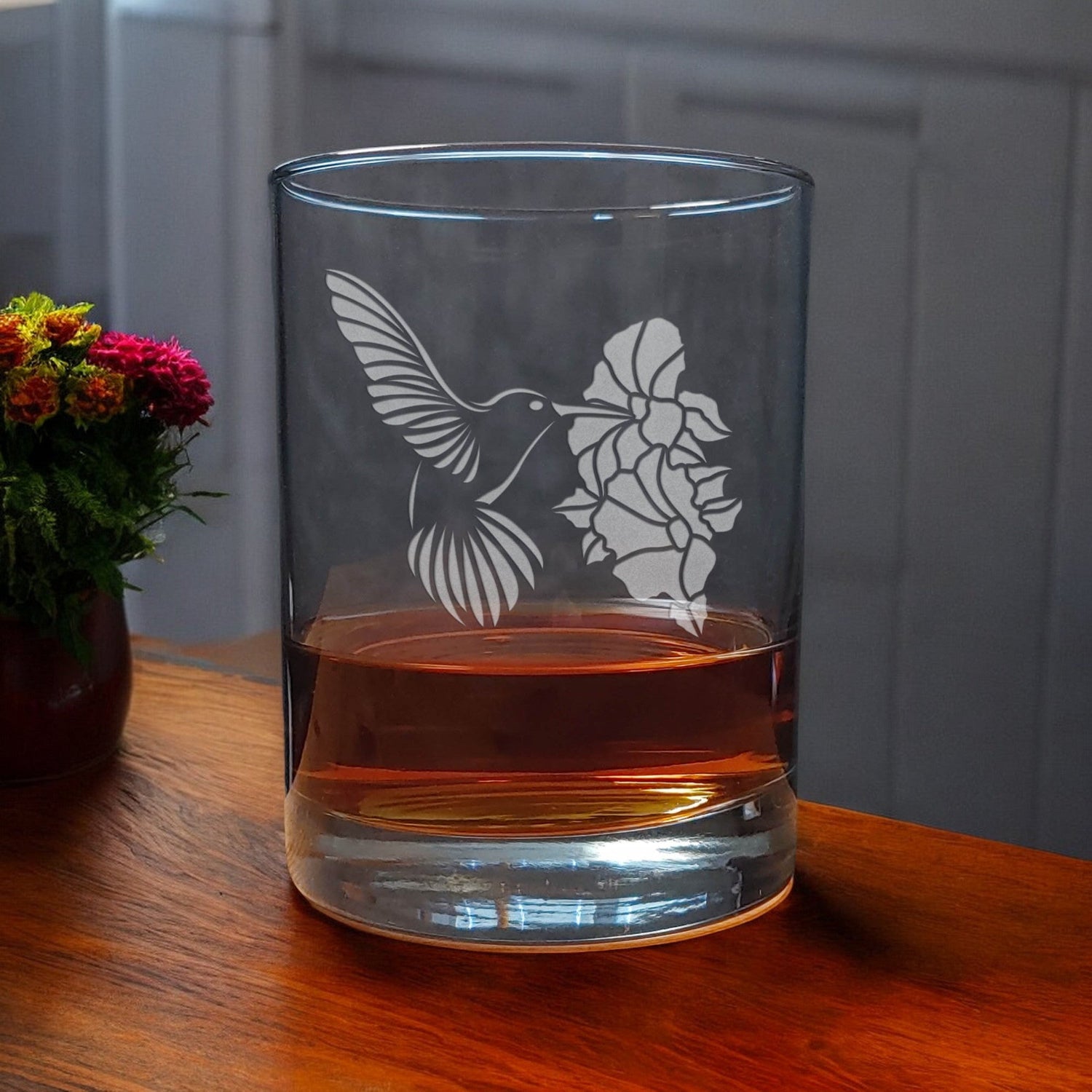 Hummingbird hovering by a hibiscus Etched 13oz Whiskey Glass - Copyright Hues in  Glass