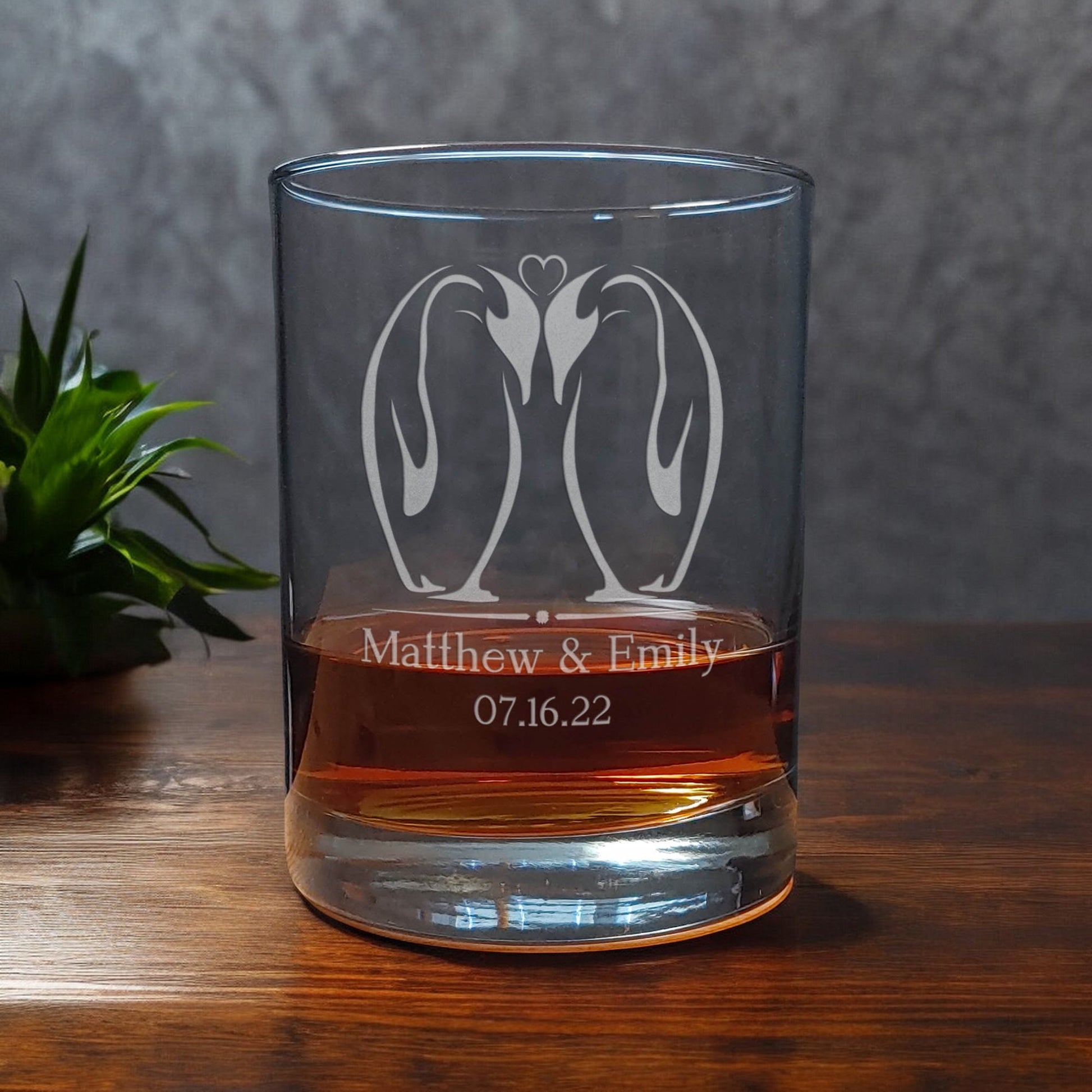 A pair of Kissing Penguins  13oz Whisky Glass -  Copyright Hues in Glass