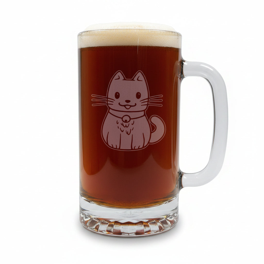 A clear glass beer mug filled with dark beer and topped with white foam, featuring an etched cat design on the front, set on a wooden surface against a white background.