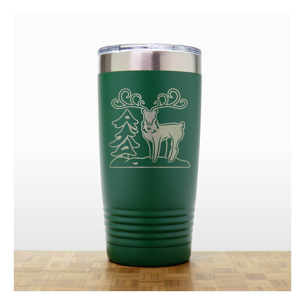 Green - Insulated Travel Mug with the design of a Reindeer sta nding beside a Christmas tree - Copyright Hues in Glass