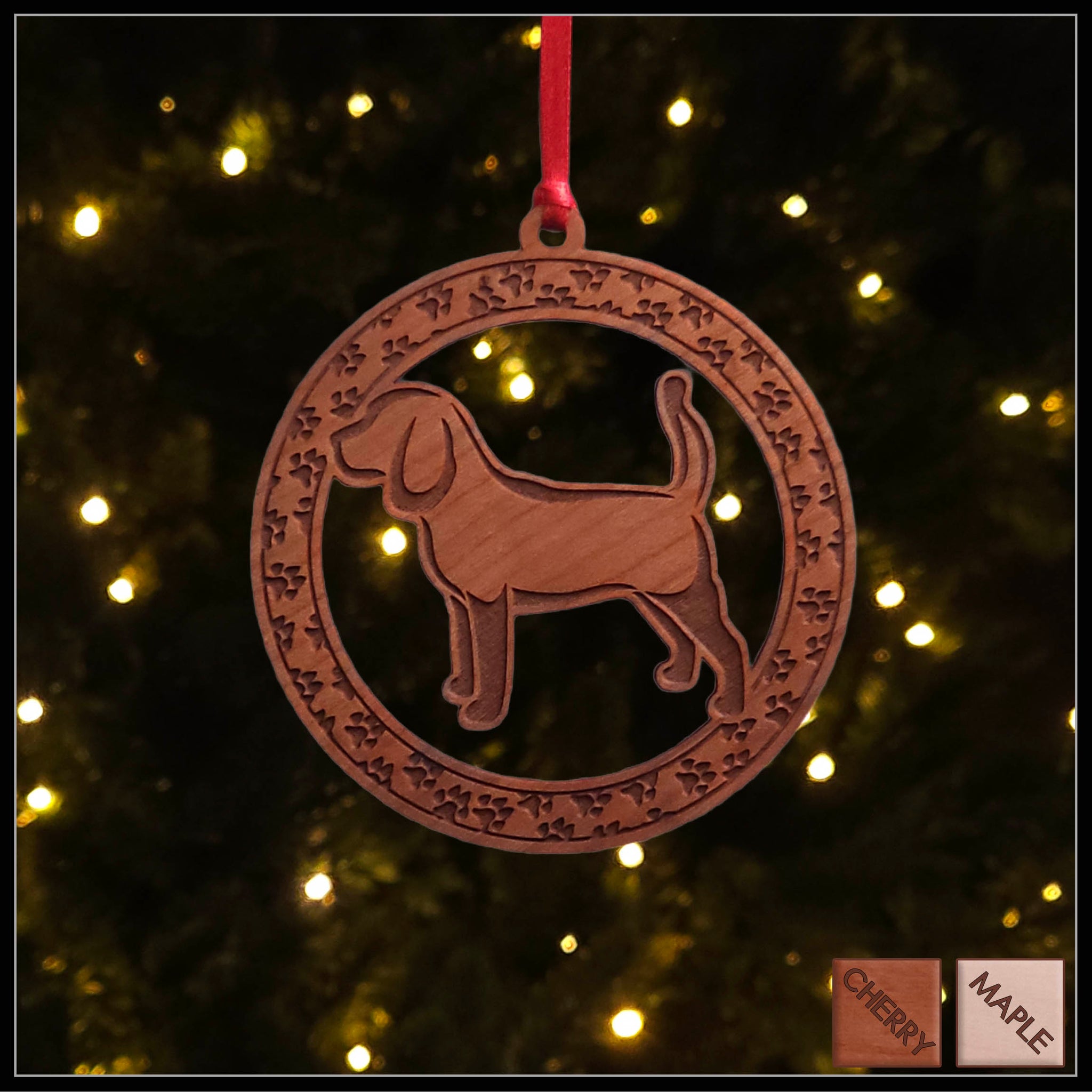 A round cherry wood veneer ornament with a border of small paw prints. The center of the ornament is a beagle dog