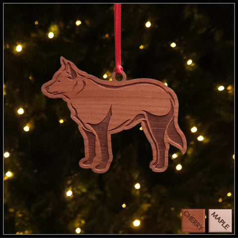 A Blue Heeler cherry wood veneer ornament, with the dog in profile. 
