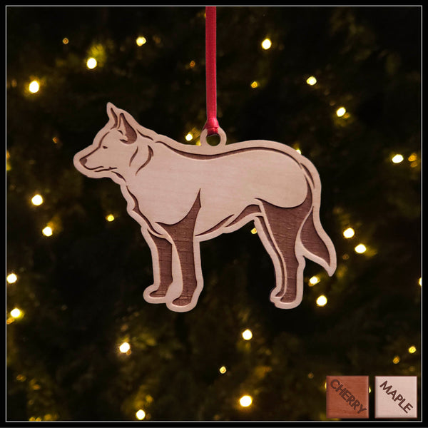 A Blue Heeler maple wood veneer ornament, with the dog in profile. 