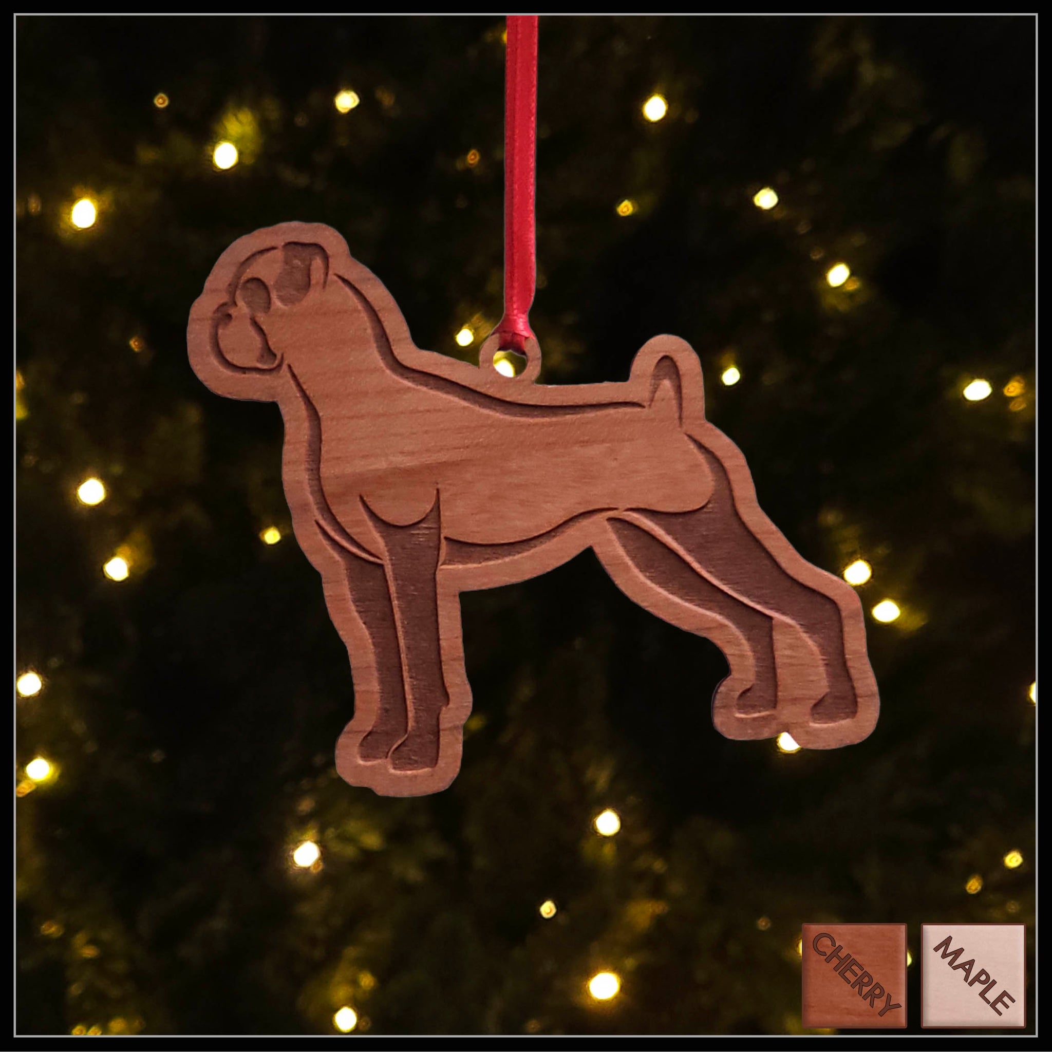 A Boxer dog cherry wood veneer ornament, with the dog in profile. 