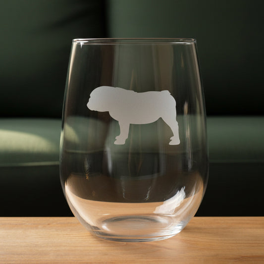 17oz Stemless Wine Glass with an etched image of a garden frog 
and a green couch in the background