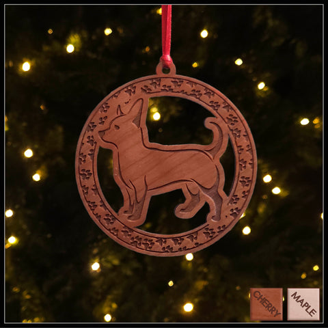 A round cherry wood veneer ornament with a border of small paw prints. The center of the ornament is a chihuahua dog