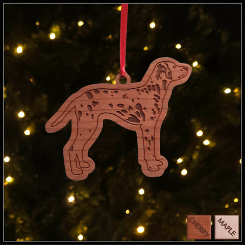 A Dalmation  cherry wood veneer ornament, with the dog in profile. 